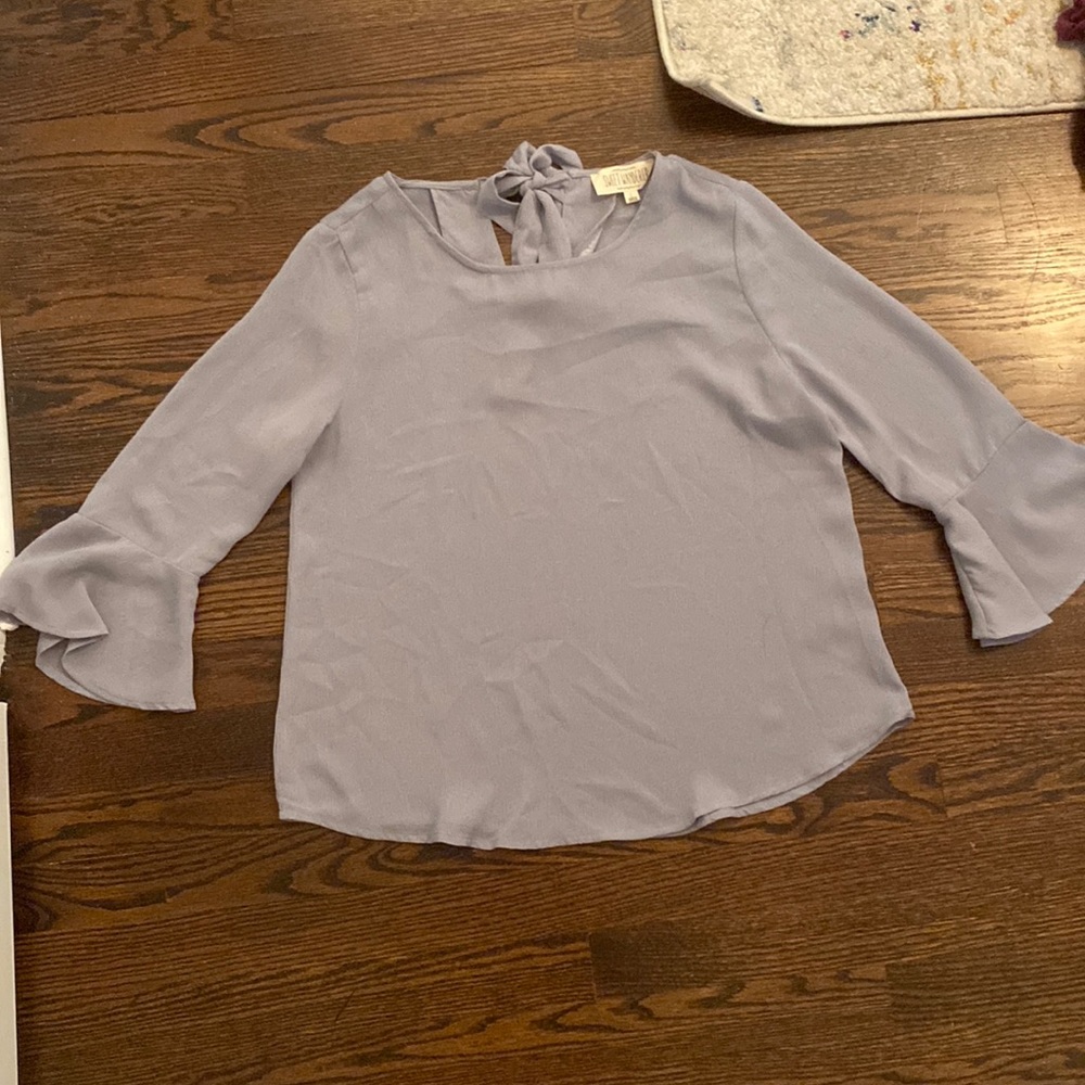 Light blue/grayish top. Loose fitting with bell sleeves and open, tie back. L